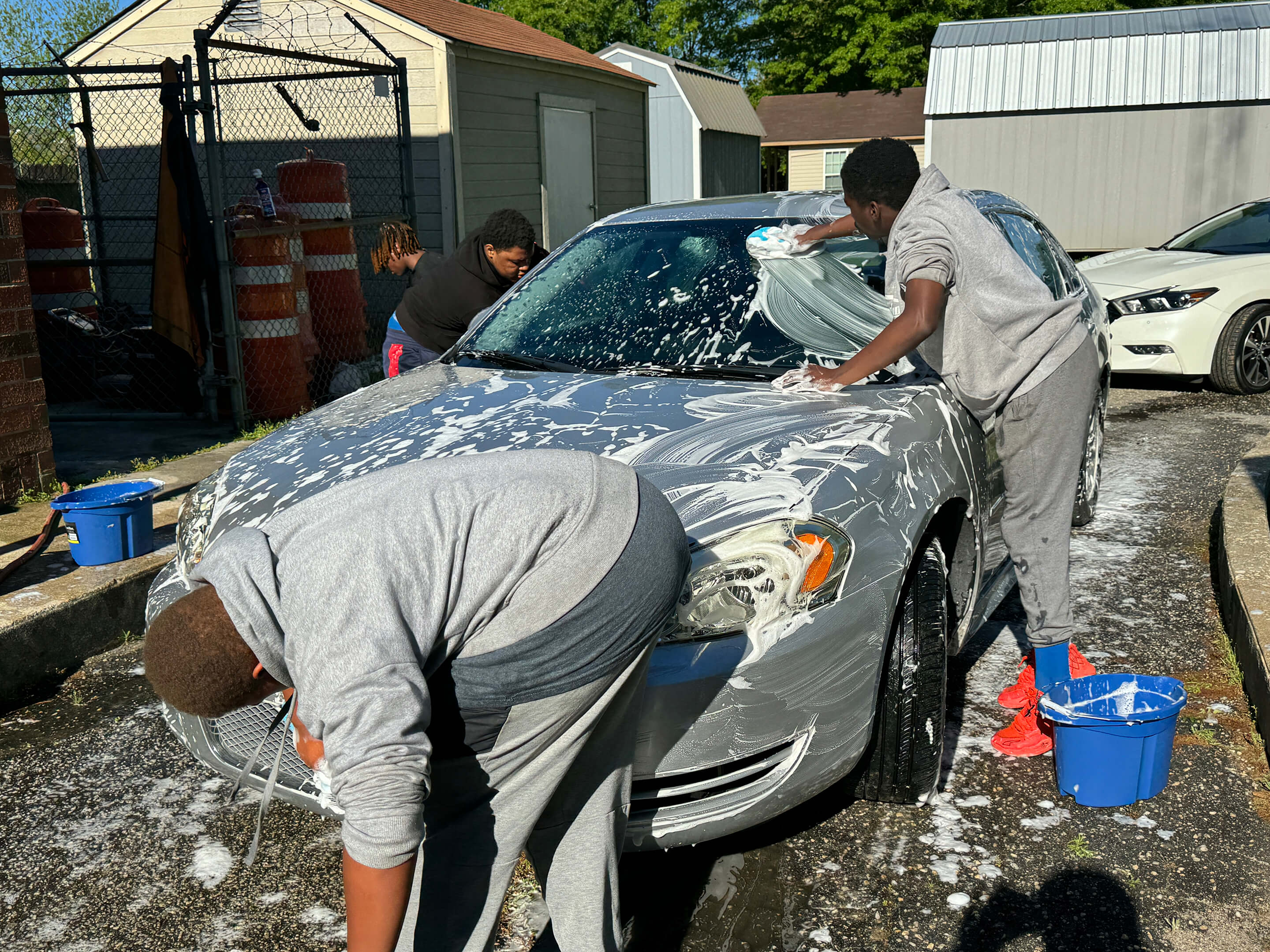 Youth washing a car